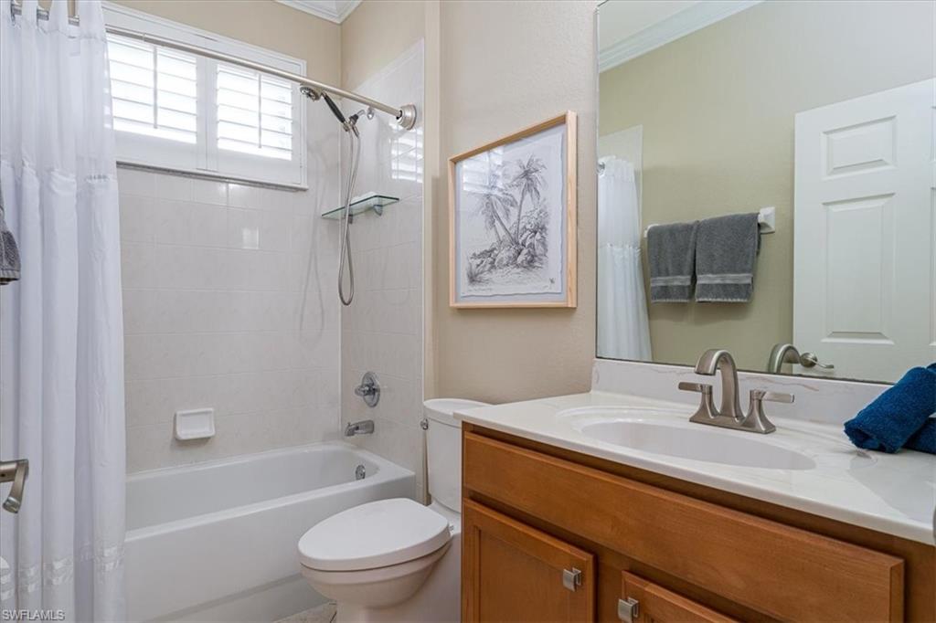 14291 Manchester Drive Naples, FL 34114 - Photo 29 of 49 a bathroom with a sink a toilet and shower