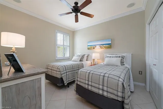 a bedroom with a bed and a dresser in it