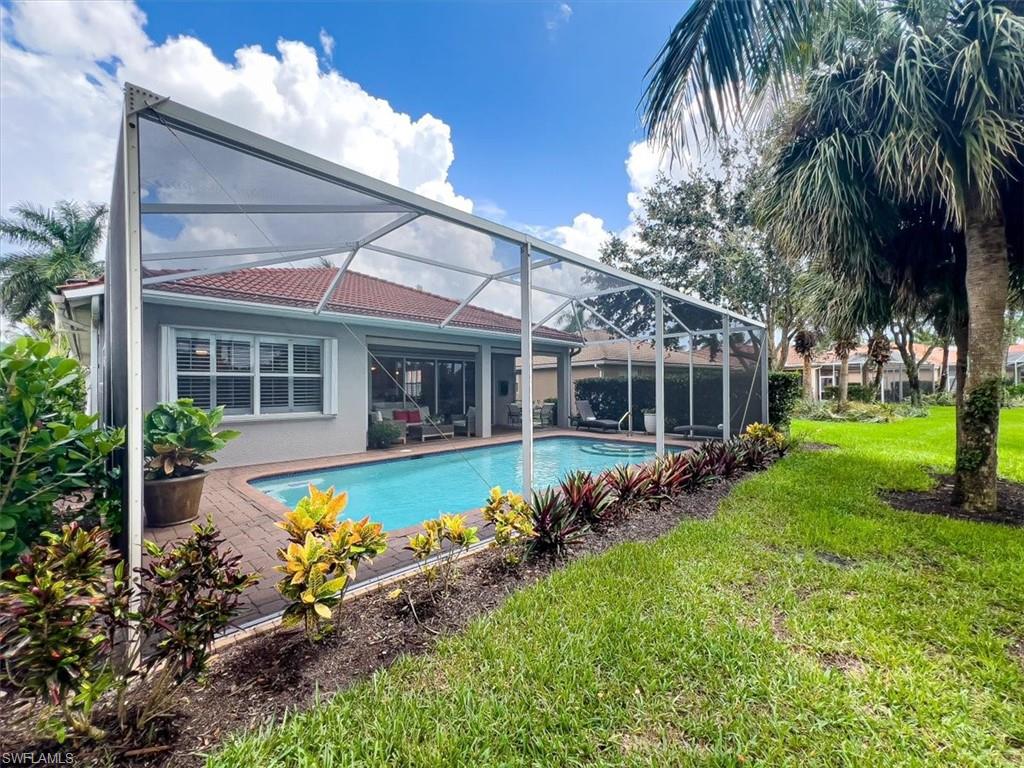 14291 Manchester Drive Naples, FL 34114 - Photo 37 of 49 front view of a house with a yard