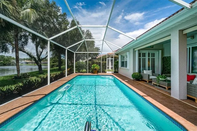 a view of a lake with houses in the back