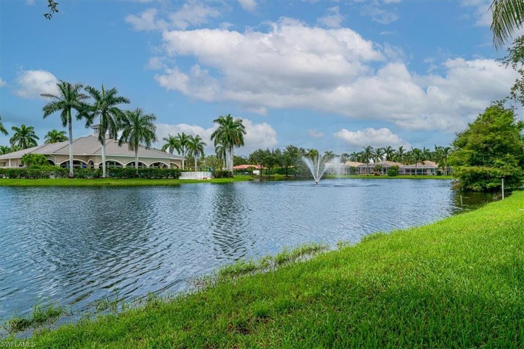14291 Manchester Drive Naples, FL 34114 - Photo 39 of 49 a view of a lake with houses in the back