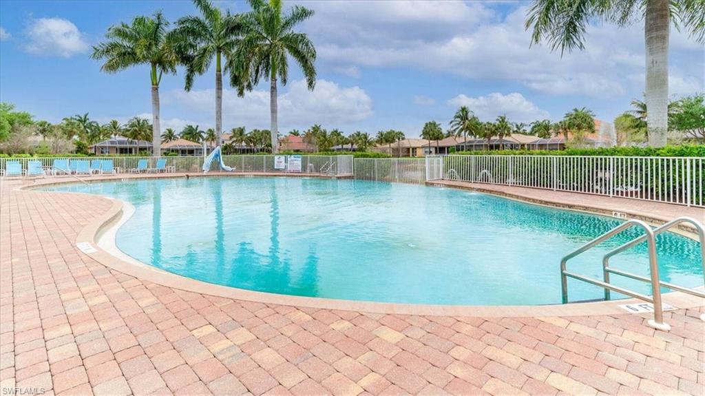 14291 Manchester Drive Naples, FL 34114 - Photo 43 of 49 a view of a lake with a palm tree