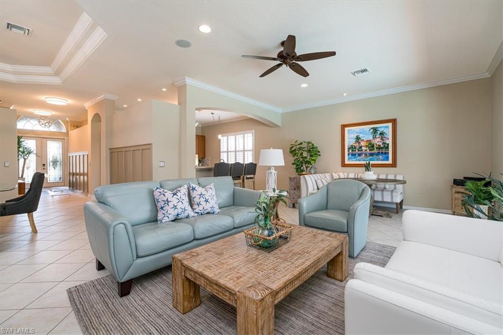 14291 Manchester Drive Naples, FL 34114 - Photo 6 of 49 a living room with furniture and a wooden floor