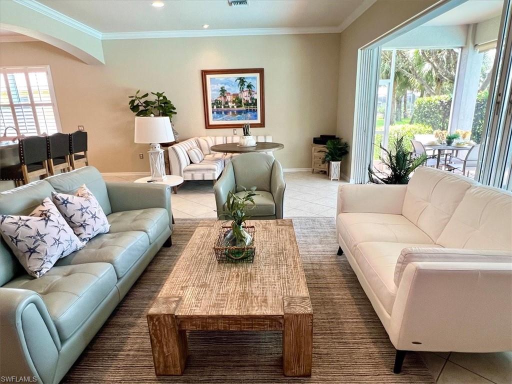 14291 Manchester Drive Naples, FL 34114 - Photo 8 of 49 a living room with furniture or couch and a large window