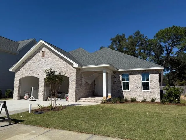 front view of a house with a garden