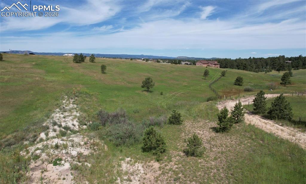 16635 Dancing Wolf Way Colorado Springs, CO 80908 - Photo 13 of 29 a view of a lake with a yard