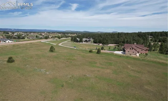 a view of a lake with a big yard