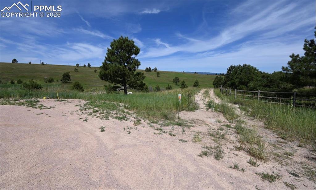 16635 Dancing Wolf Way Colorado Springs, CO 80908 - Photo 16 of 29 a view of a lake with a big yard