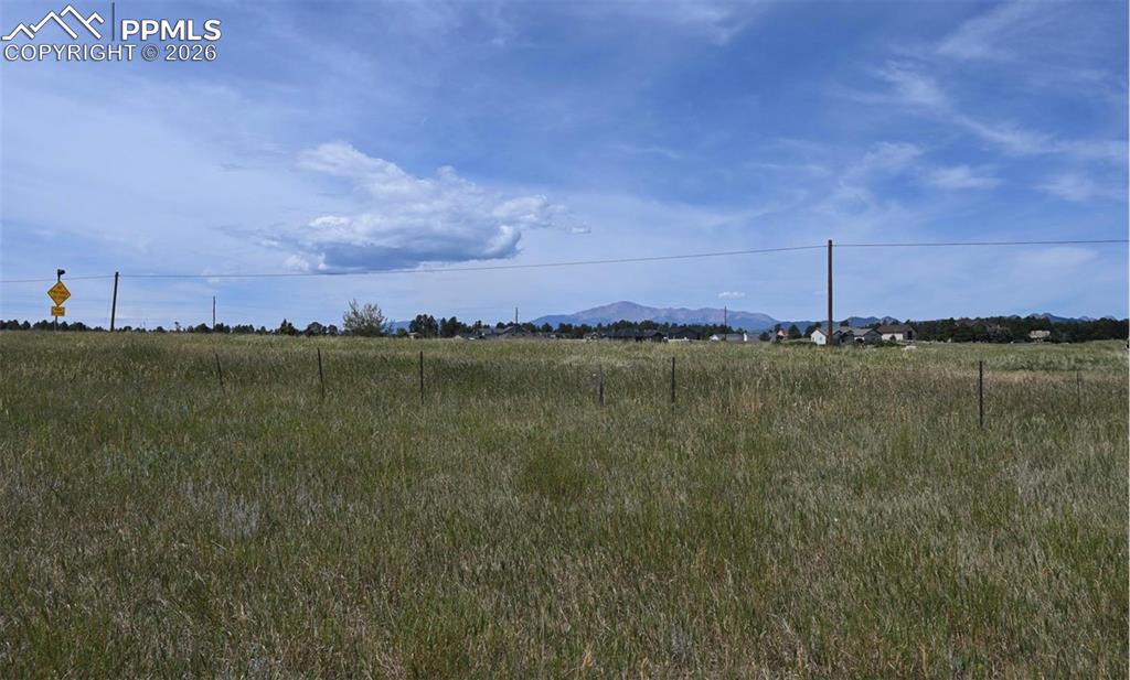 16635 Dancing Wolf Way Colorado Springs, CO 80908 - Photo 27 of 29 a view of a lake with houses in the back