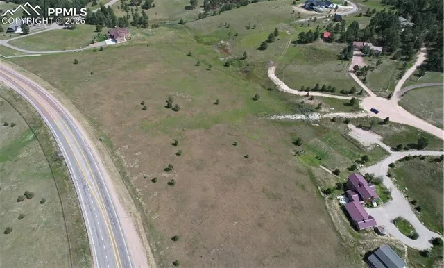an aerial view of a highlighted house