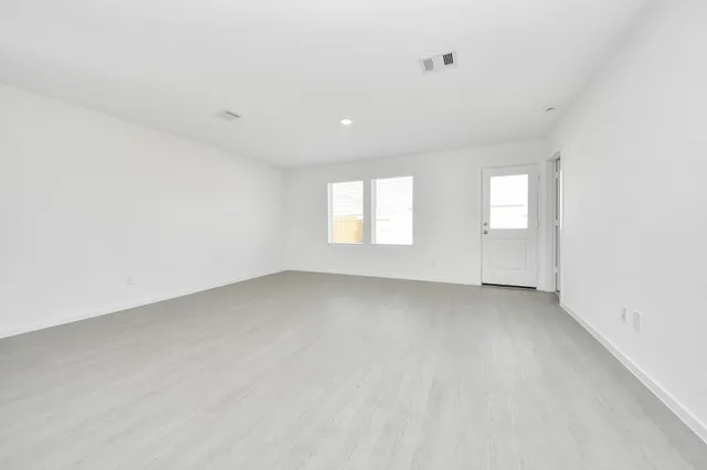 an empty room with windows