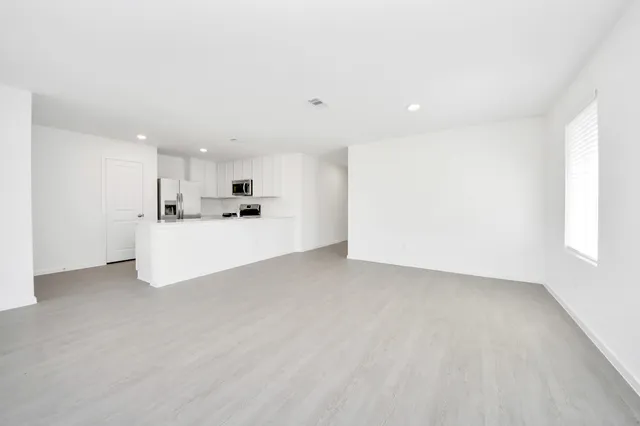 a view of a kitchen with a sink and cabinets