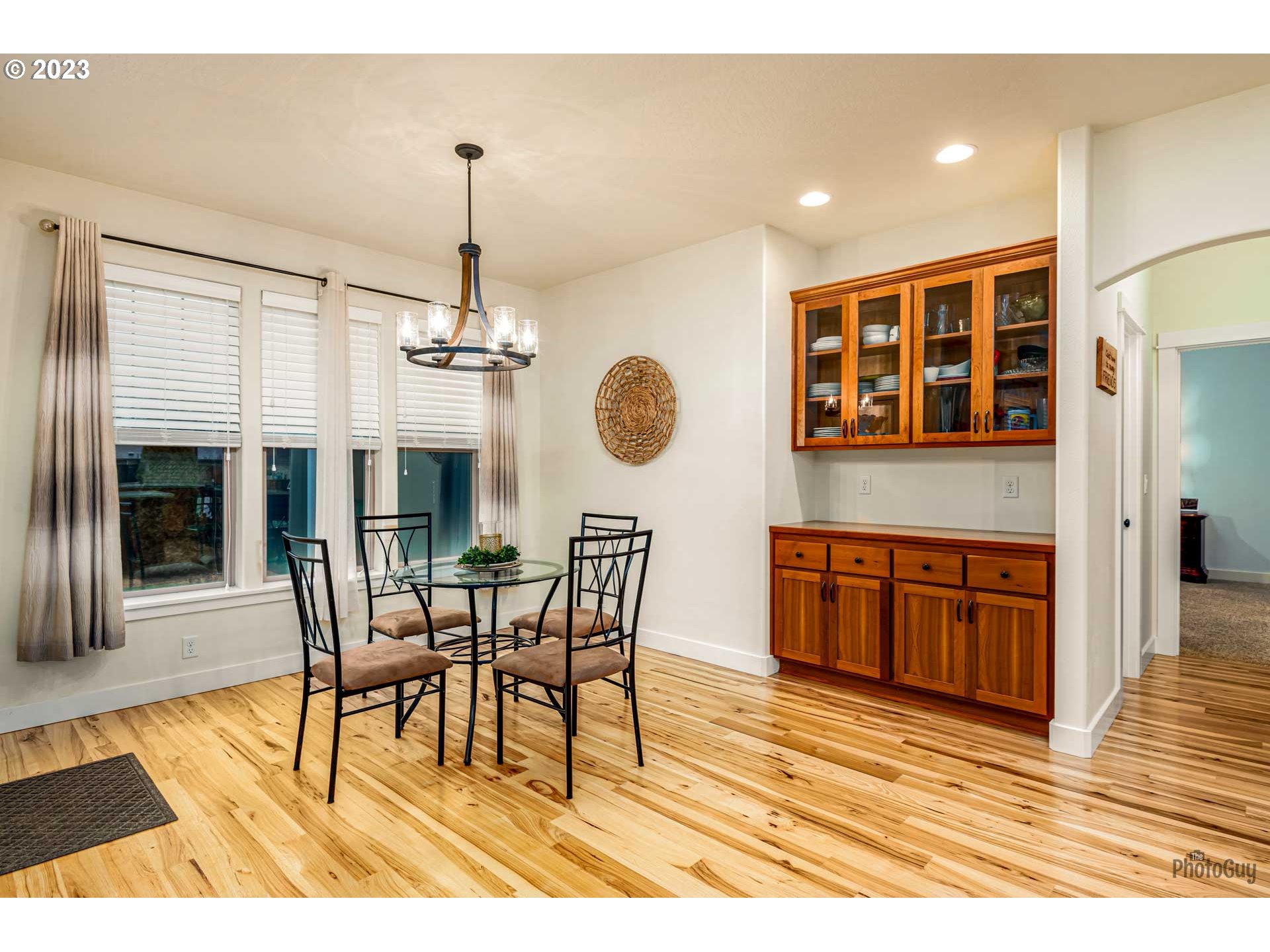 975 Riverstone Lane Springfield, OR 97477 - Photo 14 of 27 a view of a dining room with furniture and chandelier