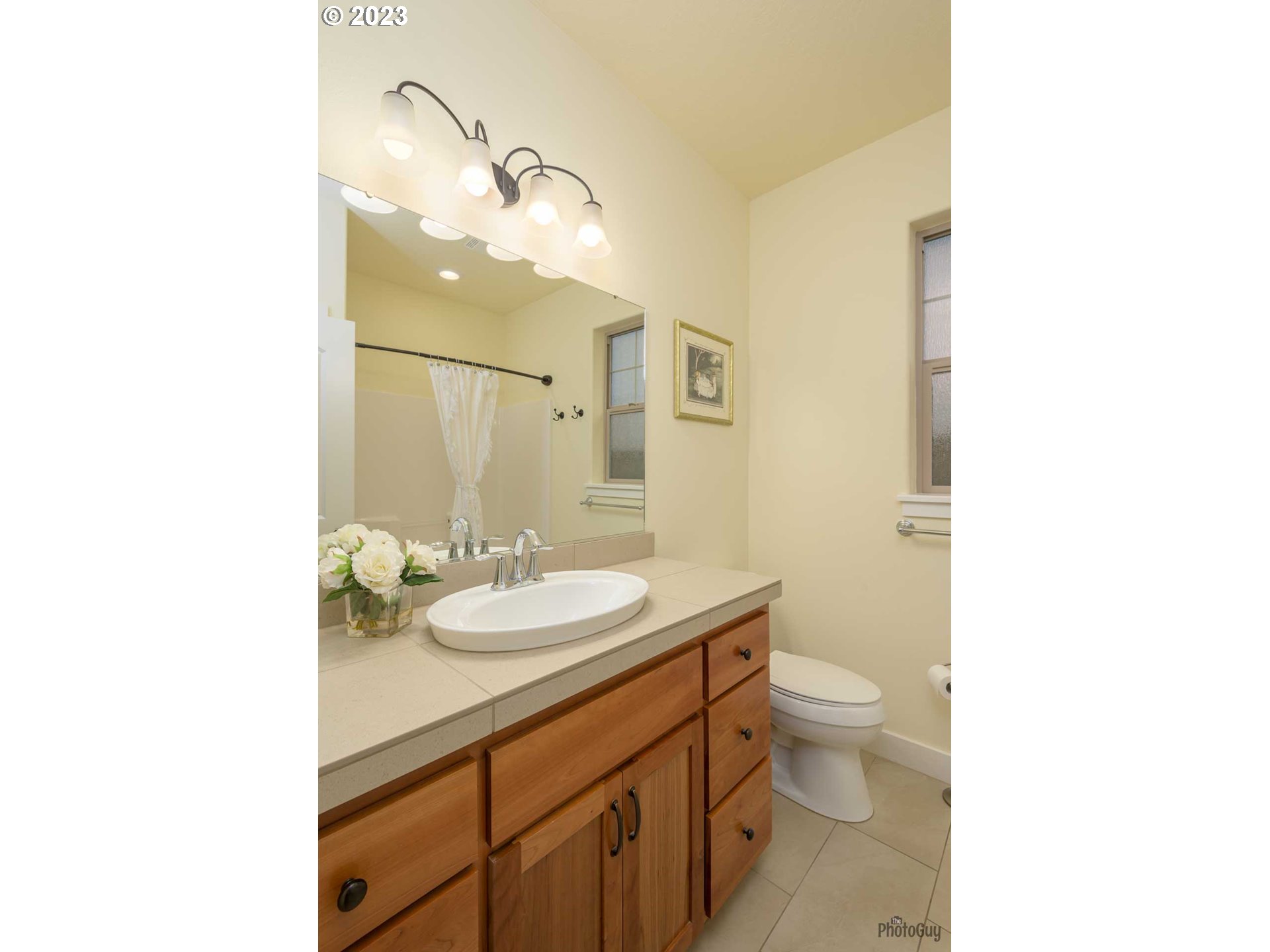 975 Riverstone Lane Springfield, OR 97477 - Photo 19 of 27 a bathroom with a sink a toilet and a mirror