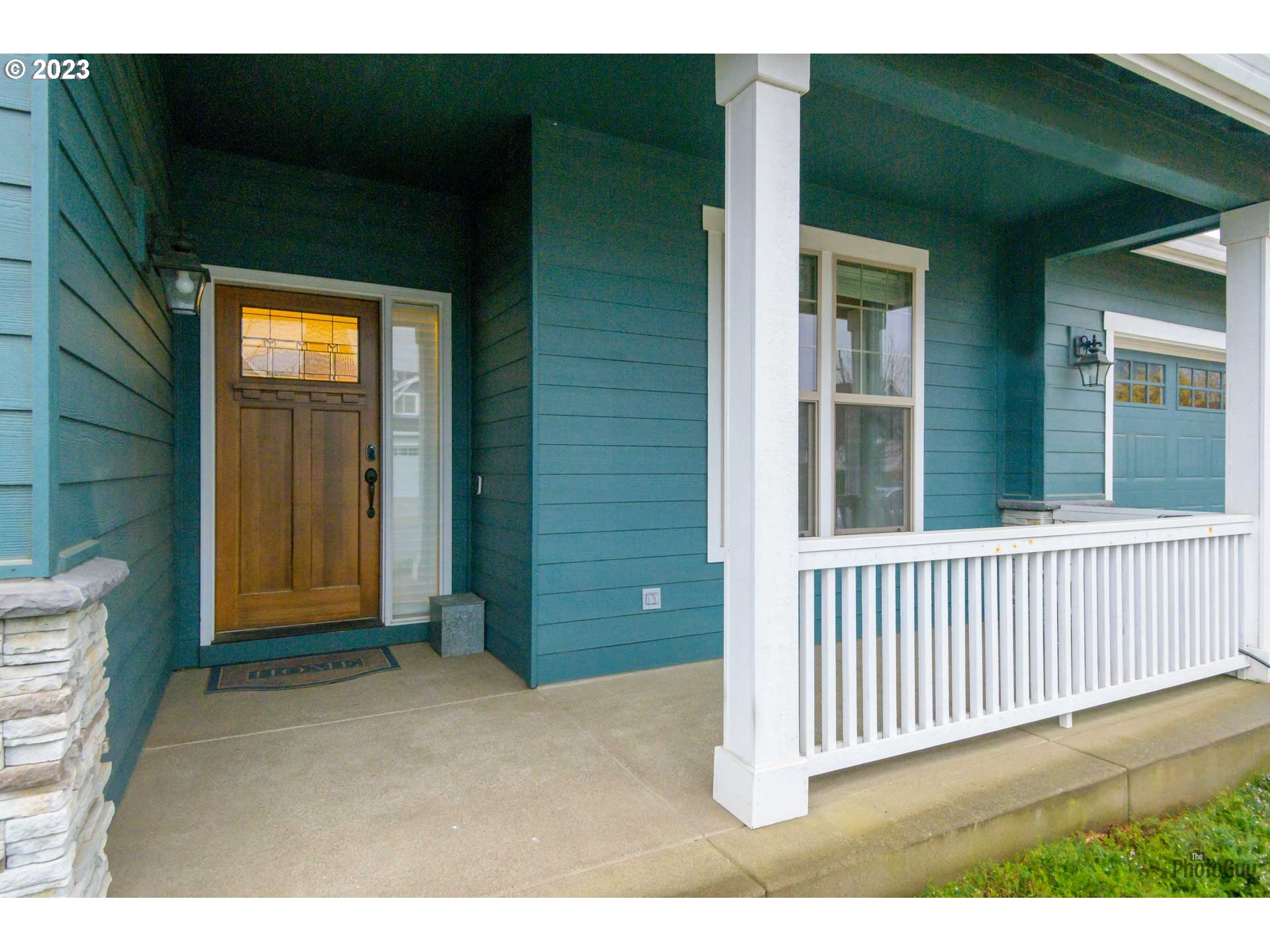 975 Riverstone Lane Springfield, OR 97477 - Photo 2 of 27 a view of a porch with a table and chair