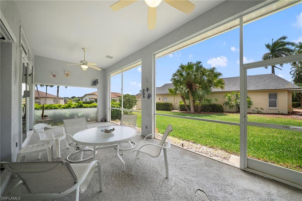 3971 Spring Garden Lane Estero, FL 33928 - Photo 28 of 31 a dining room with furniture and a yard