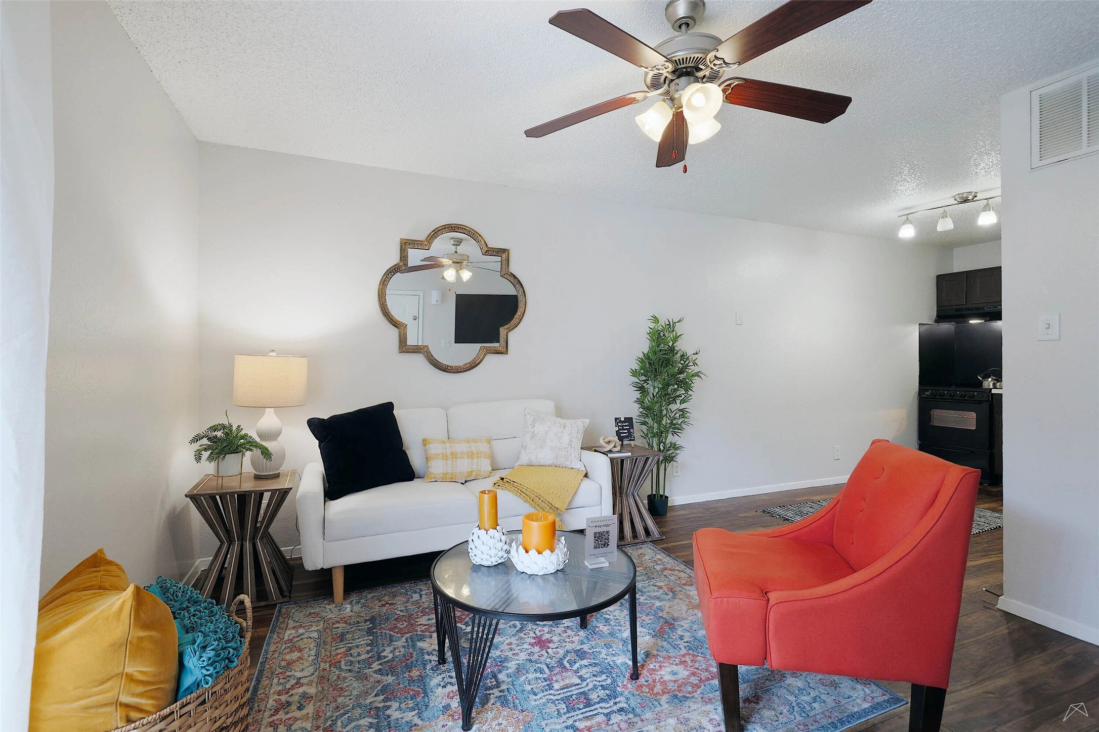 6808 South I-35 Frontage Road, Unit 111 Austin, TX 78745 - Photo 12 of 22 a living room with furniture and a potted plant