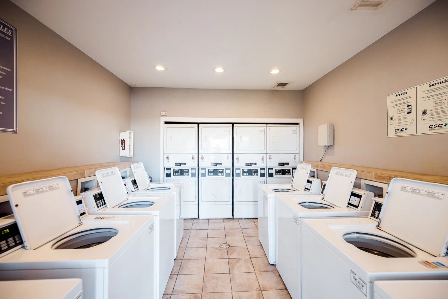6808 South I-35 Frontage Road, Unit 111 Austin, TX 78745 - Photo 18 of 22 a kitchen with a refrigerator and a stove top oven