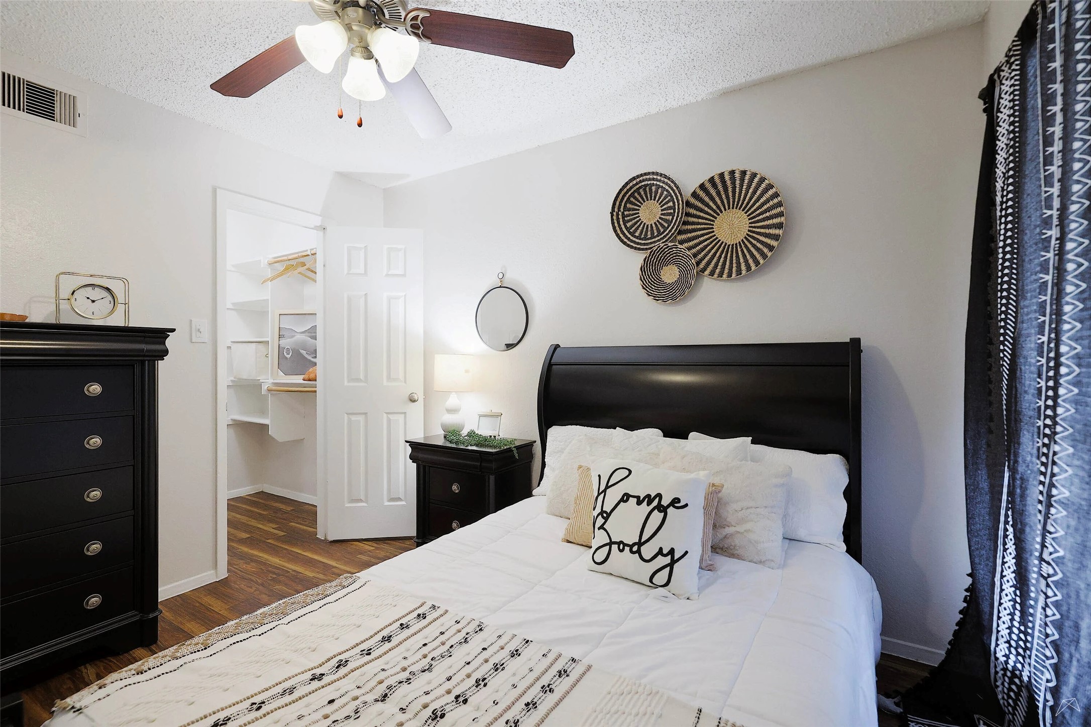 6808 South I-35 Frontage Road, Unit 111 Austin, TX 78745 - Photo 3 of 22 a bedroom with a bed and a chandelier