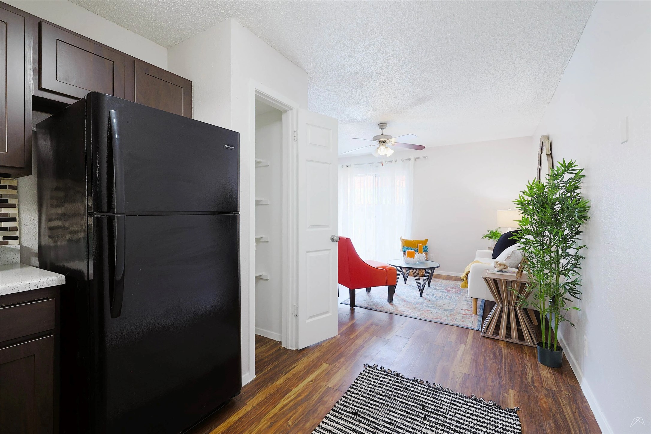 6808 South I-35 Frontage Road, Unit 111 Austin, TX 78745 - Photo 7 of 22 a kitchen with stainless steel appliances a refrigerator and a table