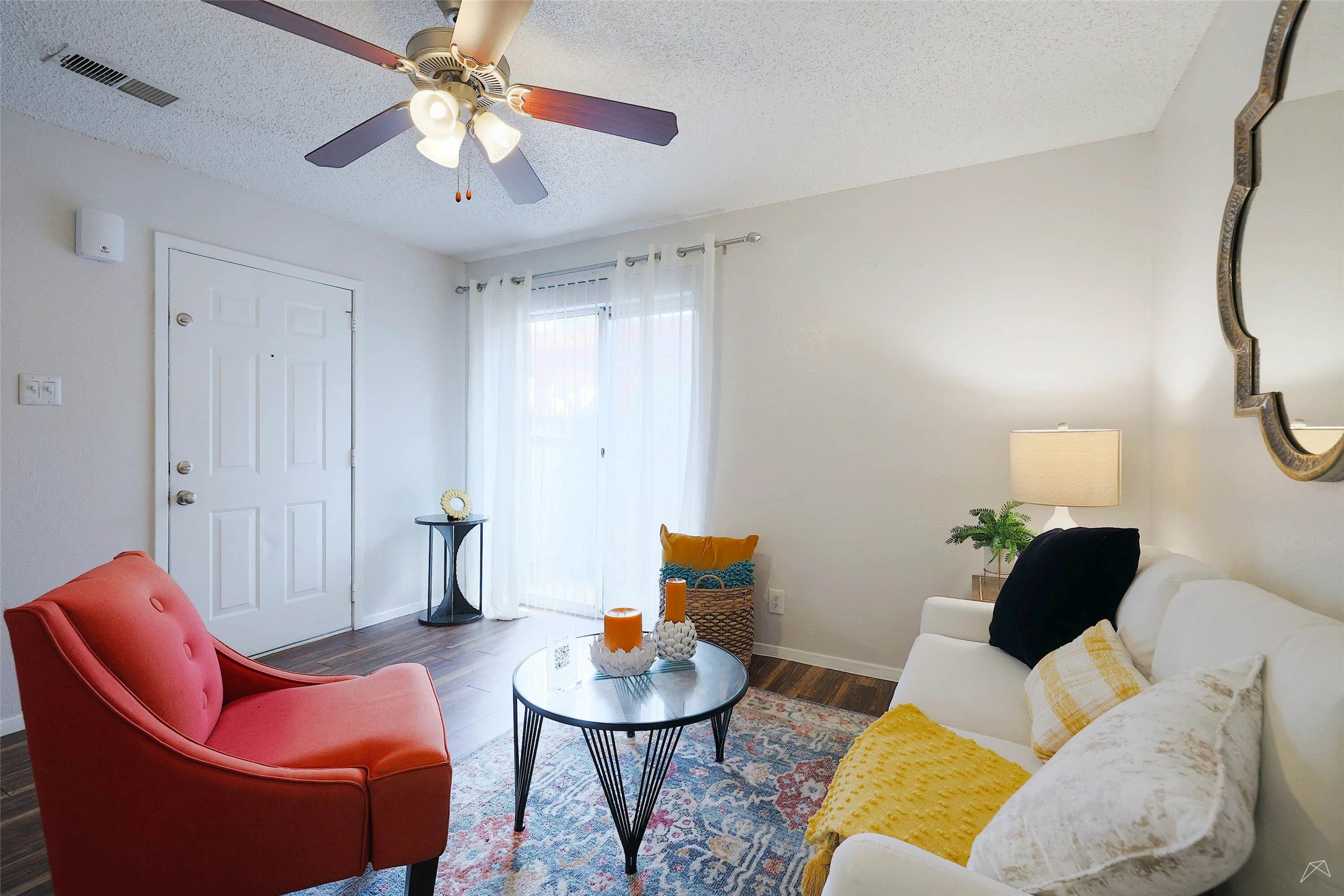 6808 South I-35 Frontage Road, Unit 111 Austin, TX 78745 - Photo 10 of 22 a living room with furniture and a chandelier