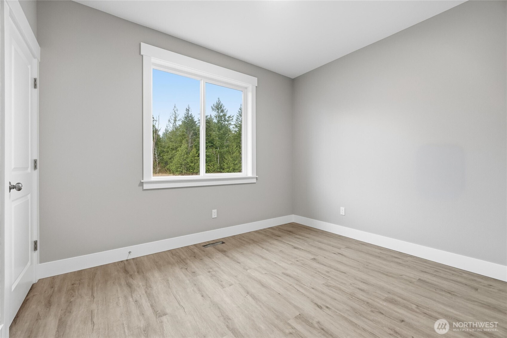 6473 Watson Loop Maple Falls, WA 98266 - Photo 14 of 25 wooden floor in an empty room with a window