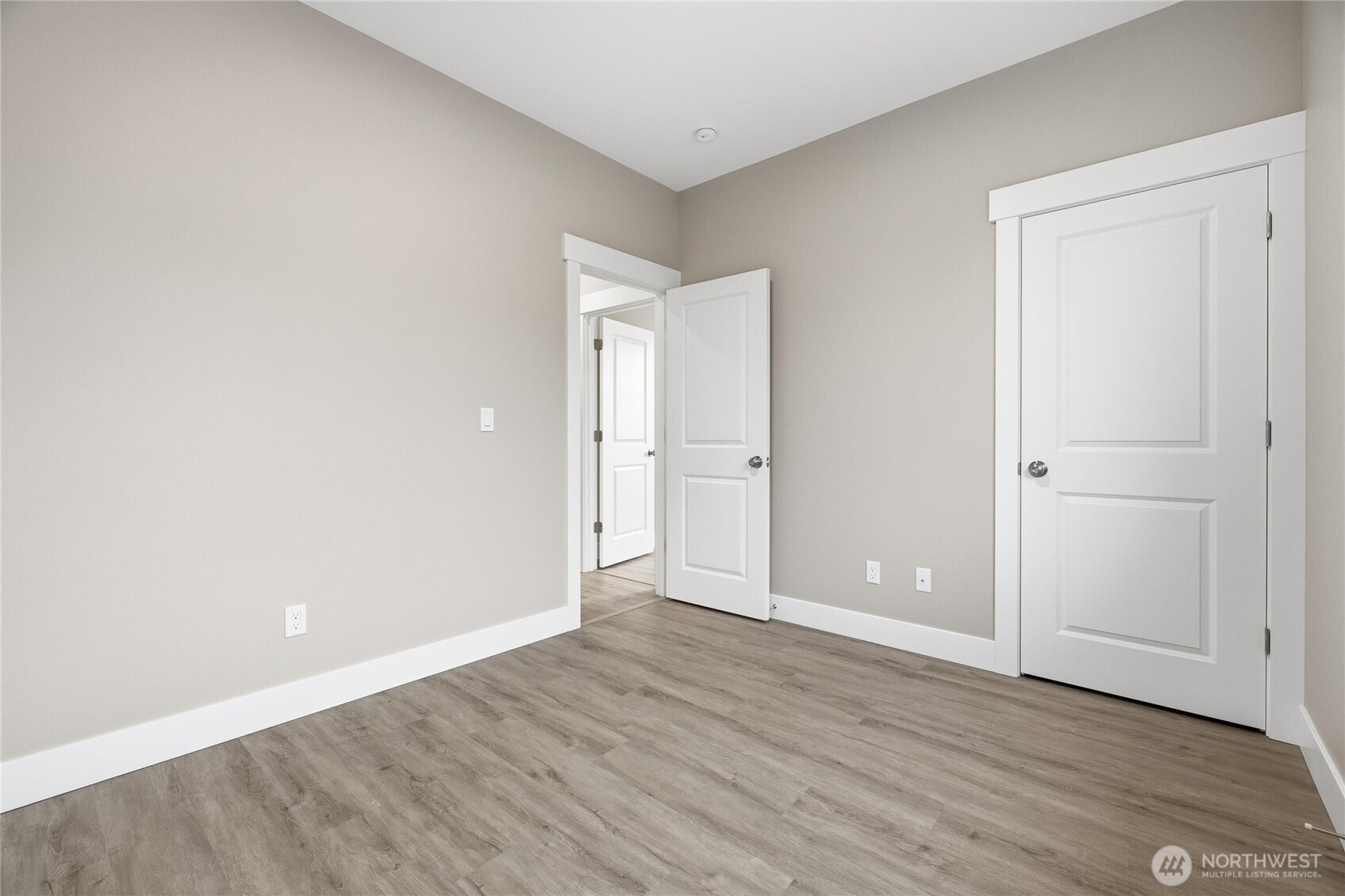 6473 Watson Loop Maple Falls, WA 98266 - Photo 15 of 25 a view of an empty room with wooden floor and closet