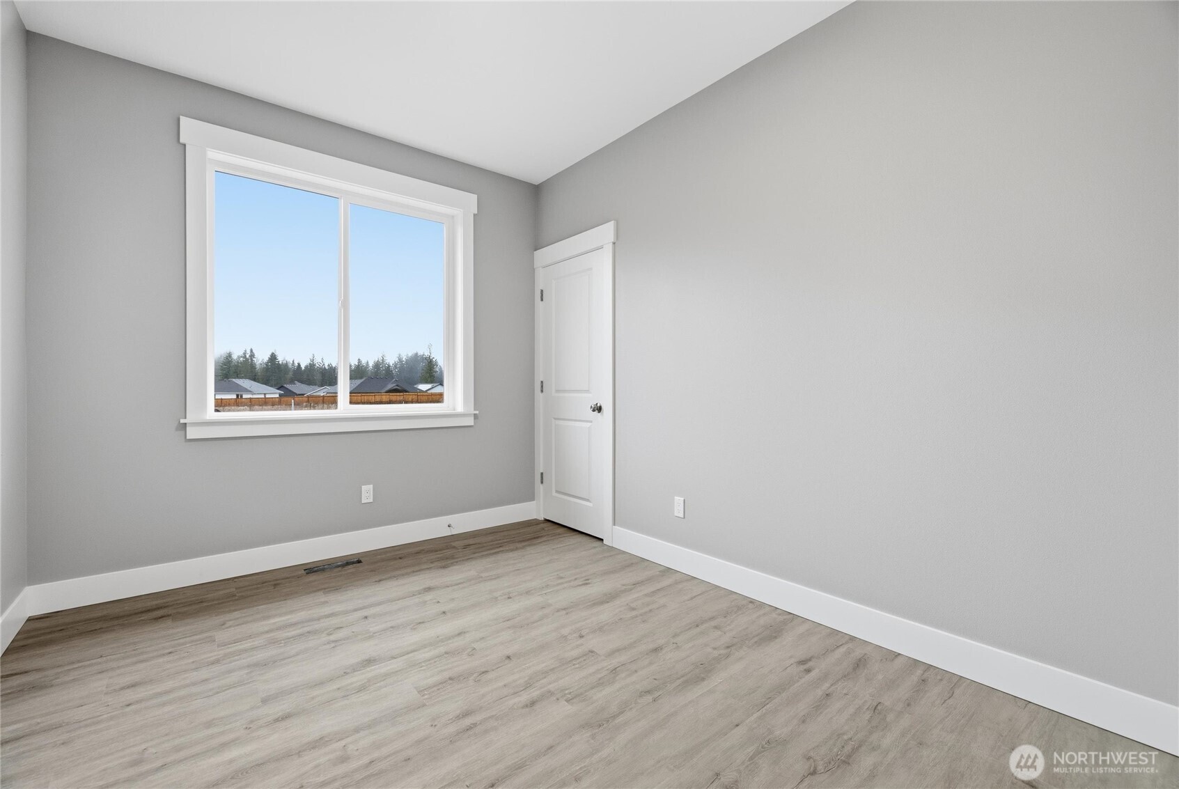 6473 Watson Loop Maple Falls, WA 98266 - Photo 17 of 25 a view of an empty room with wooden floor and a window