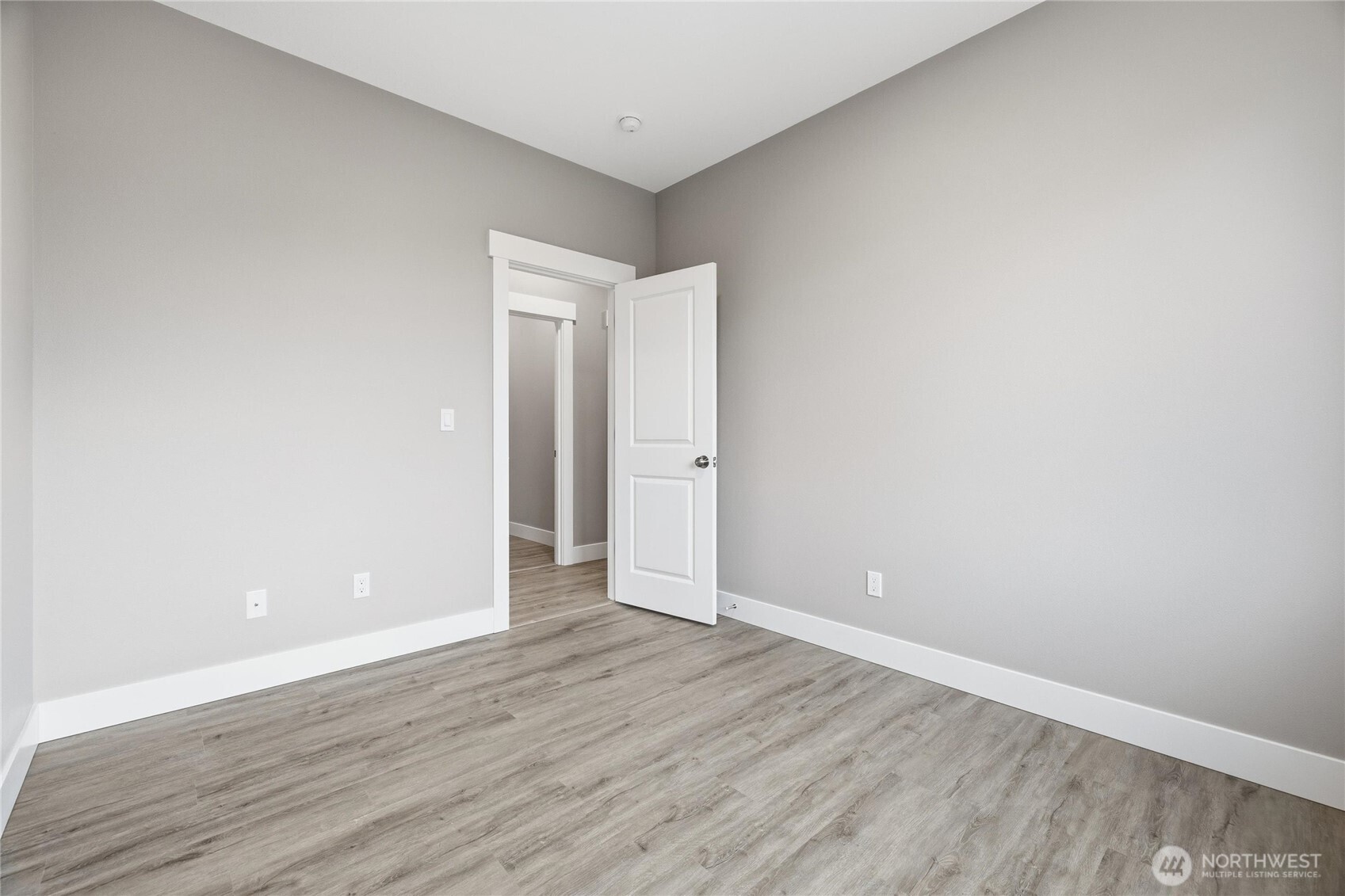 6473 Watson Loop Maple Falls, WA 98266 - Photo 18 of 25 a view of an empty room with wooden floor