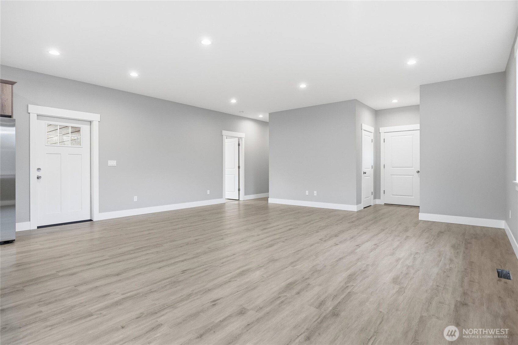 6473 Watson Loop Maple Falls, WA 98266 - Photo 3 of 25 a view of an empty room with wooden floor and closet