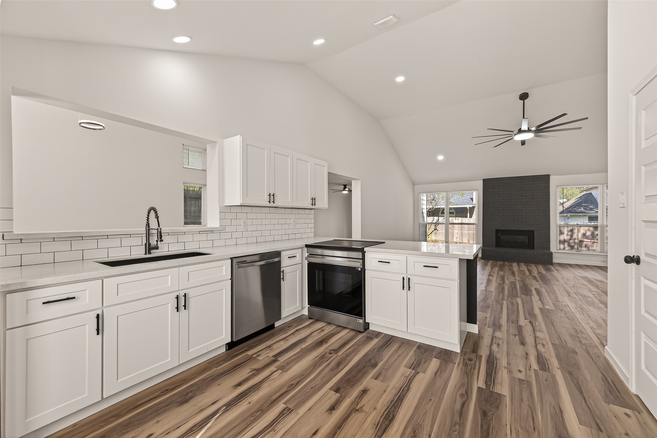 2915 Whispering Springs Drive Spring, TX 77373 - Photo 17 of 36 Seamless flow from kitchen to living room, perfect for entertaining and everyday living.