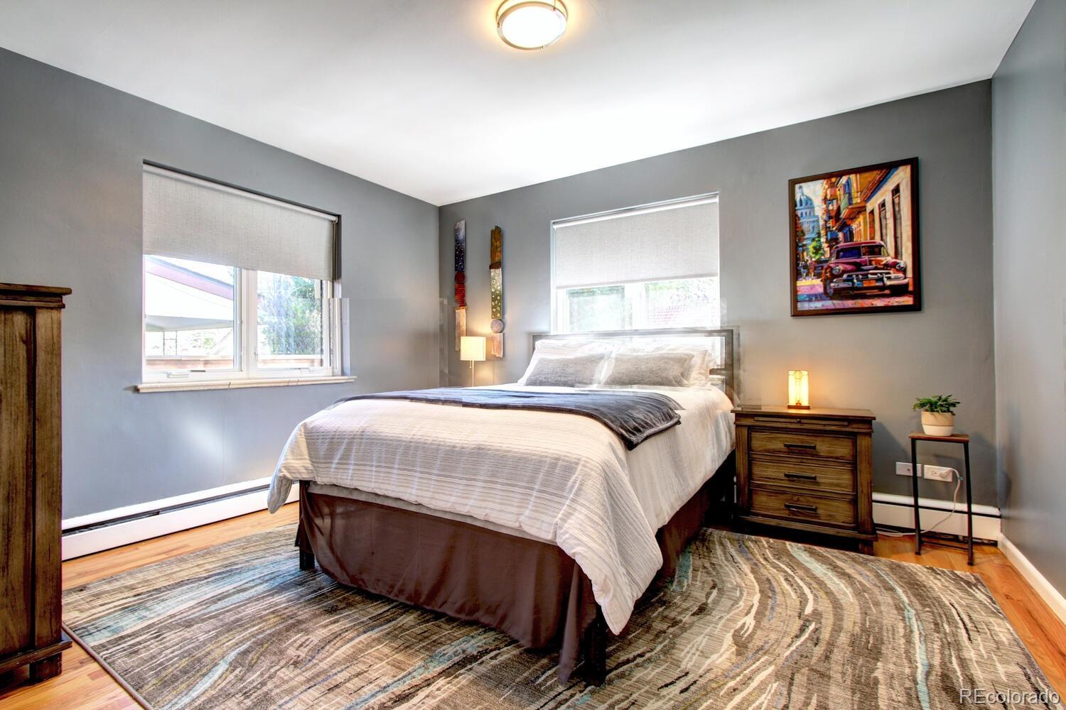 1300 Elm Street Denver, CO 80220 - Photo 21 of 40 a bed sitting in a bedroom next to a window
