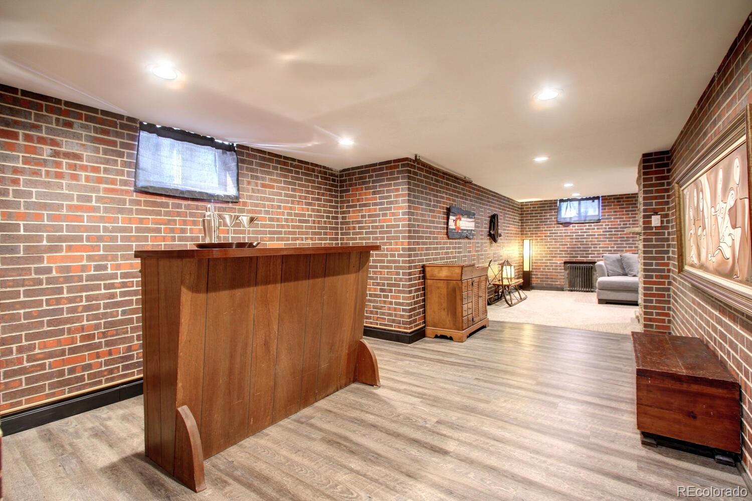 1300 Elm Street Denver, CO 80220 - Photo 22 of 40 a lobby with furniture and wooden floor