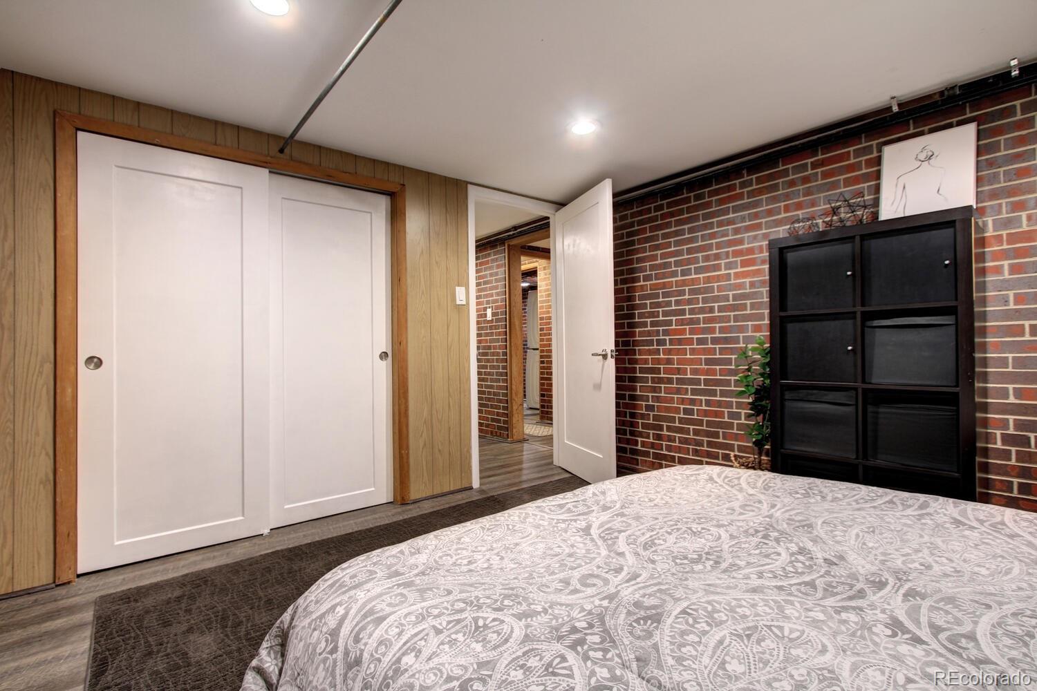 1300 Elm Street Denver, CO 80220 - Photo 29 of 40 a bedroom with a bed and a mirror