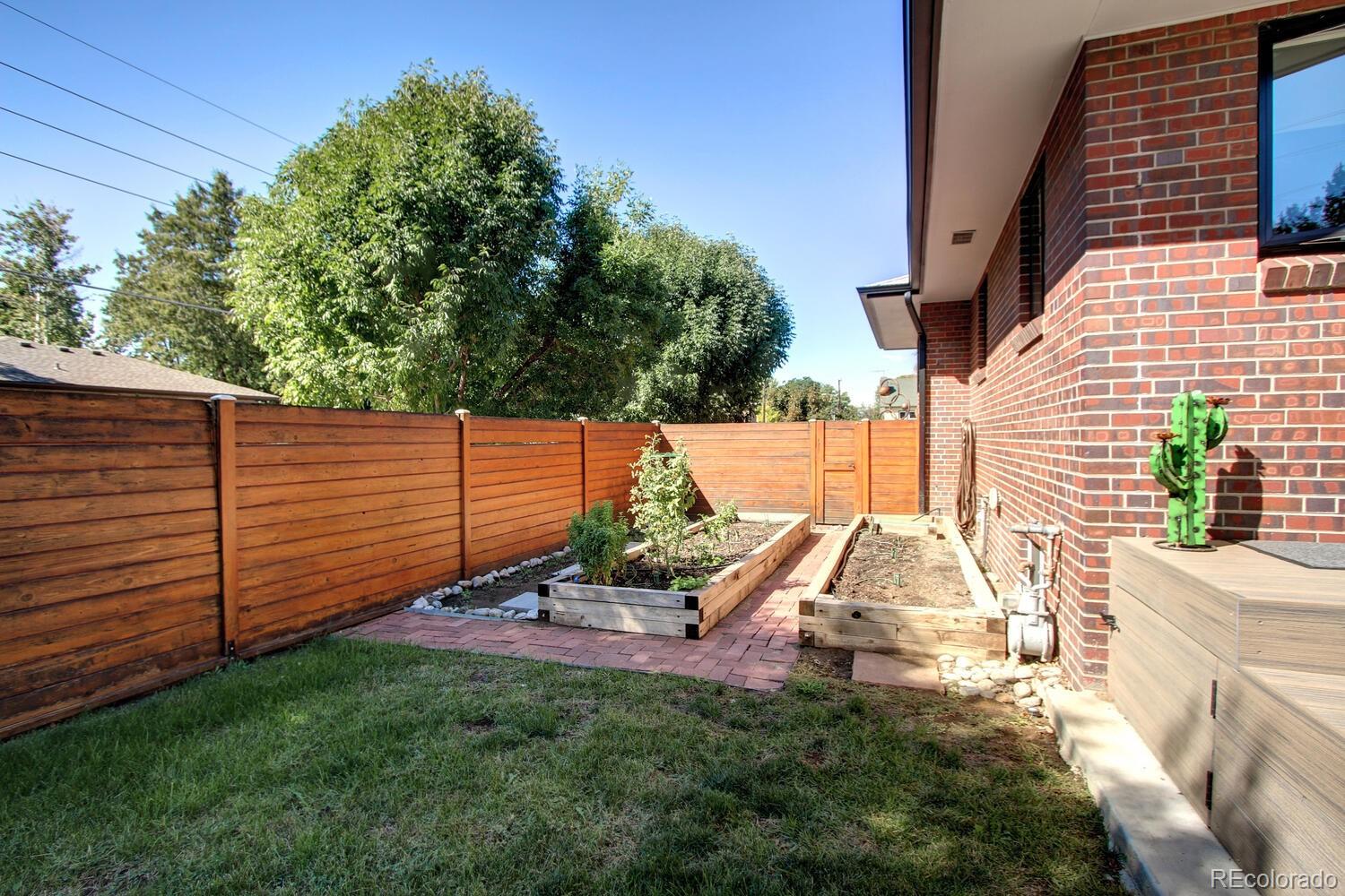 1300 Elm Street Denver, CO 80220 - Photo 35 of 40 a view of a backyard with sitting area