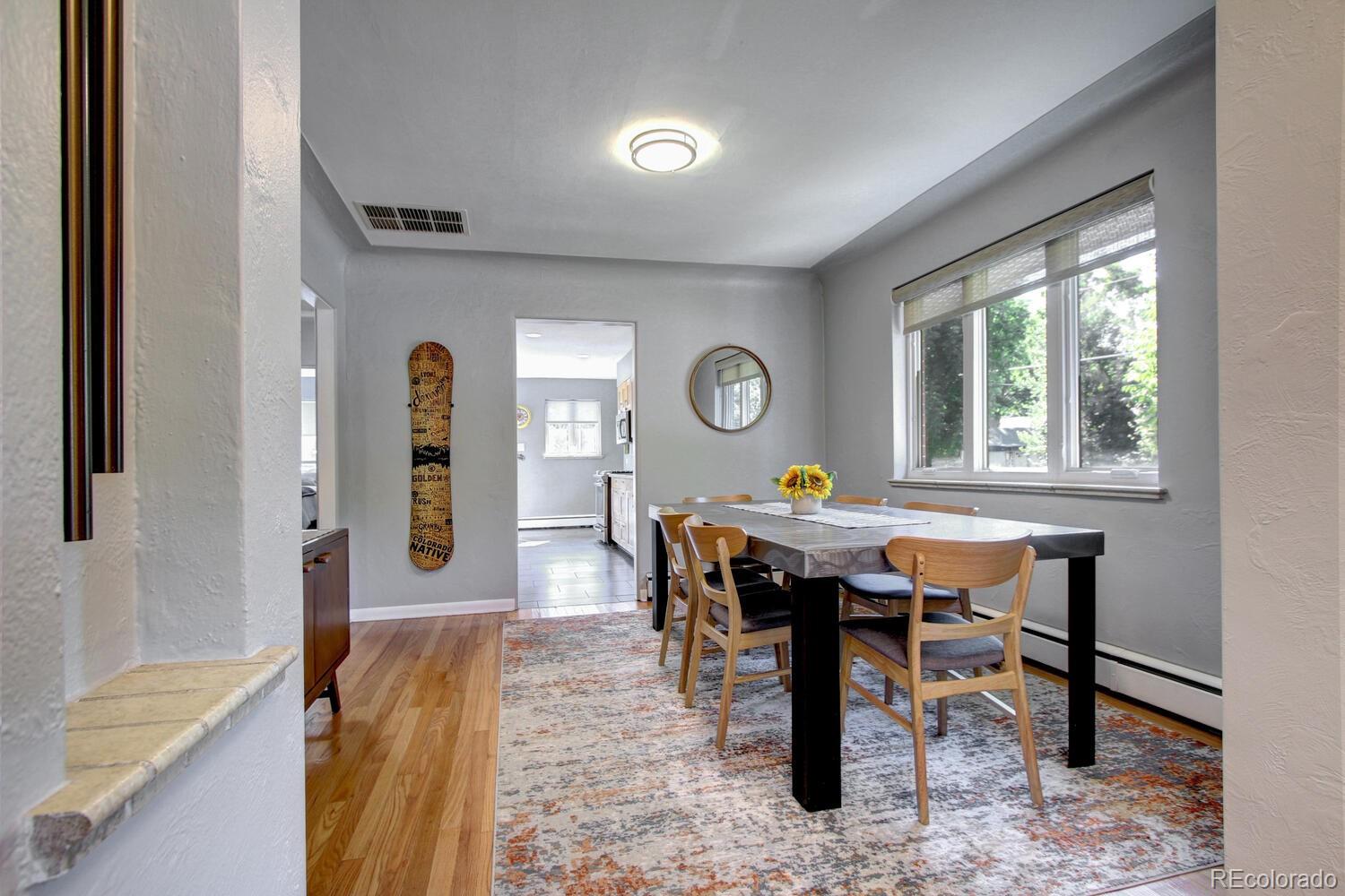 1300 Elm Street Denver, CO 80220 - Photo 8 of 40 a view of a dining room with furniture and window