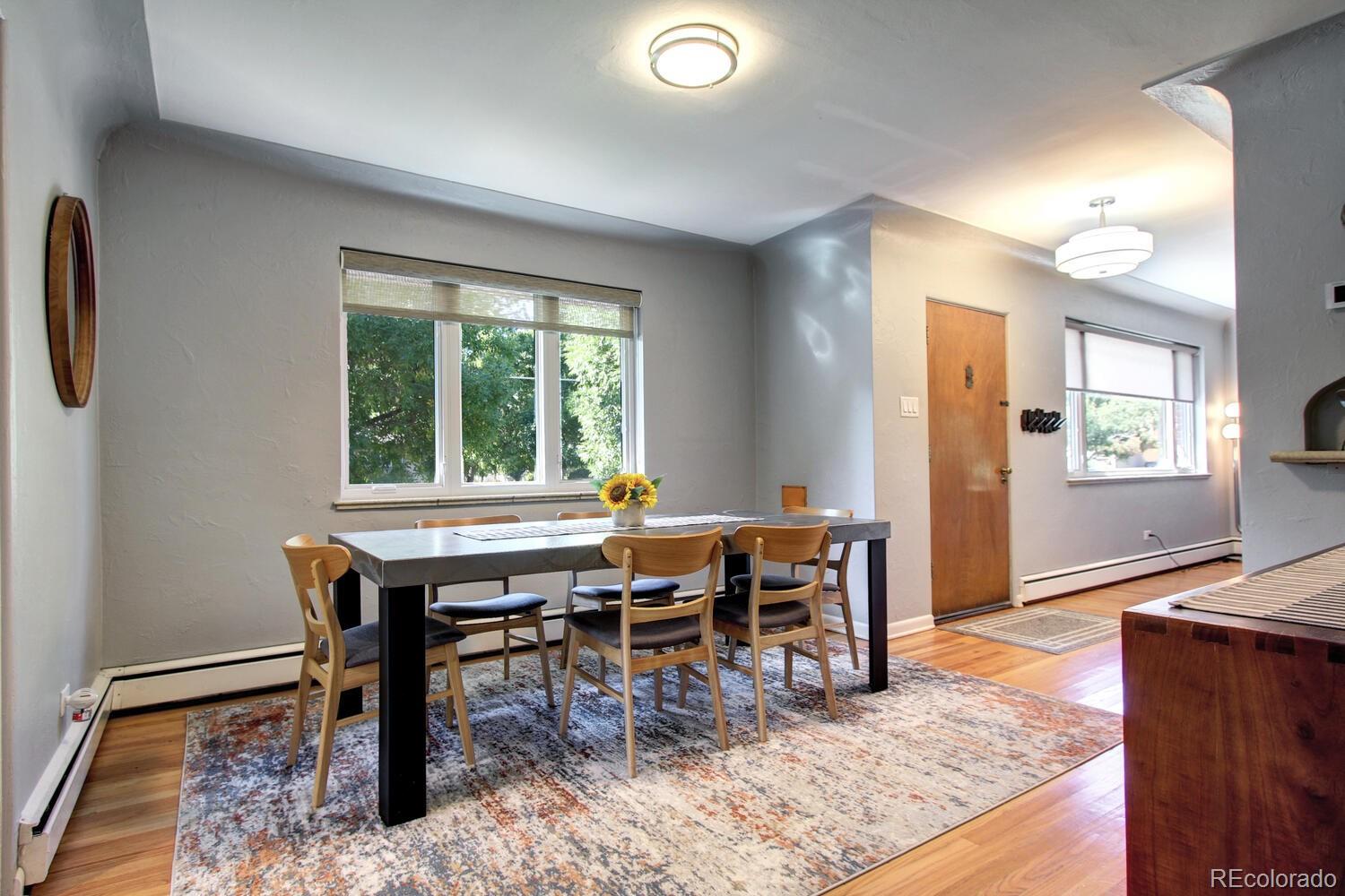 1300 Elm Street Denver, CO 80220 - Photo 9 of 40 a view of a workspace with furniture and a window
