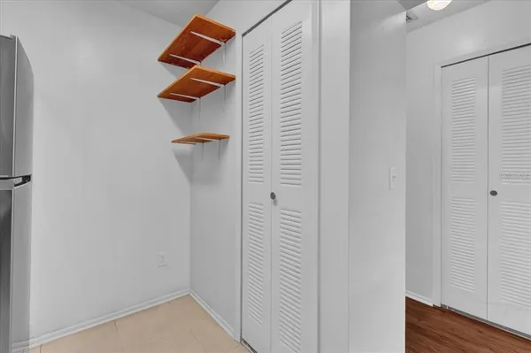 a view of small space with empty racks on the wall