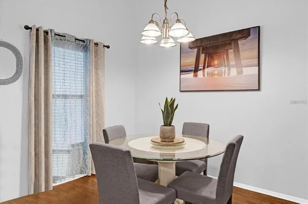 a dining room with furniture and window