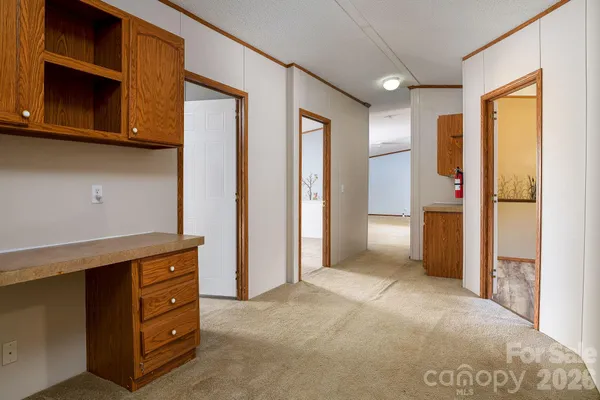 a view of an empty room with a fireplace