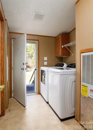 a view of empty room with a fireplace