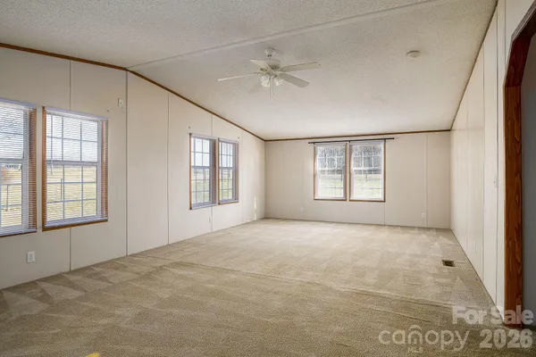 a view of balcony with wooden floor and door