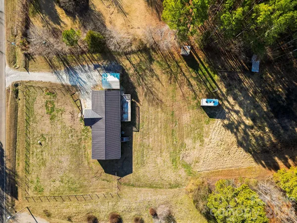 an aerial view of residential house with outdoor space