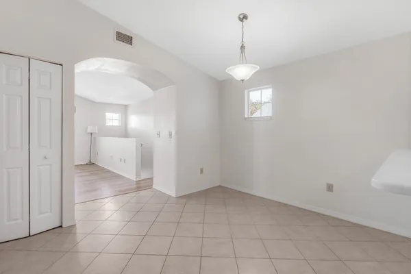 a view of an empty room with a bathroom