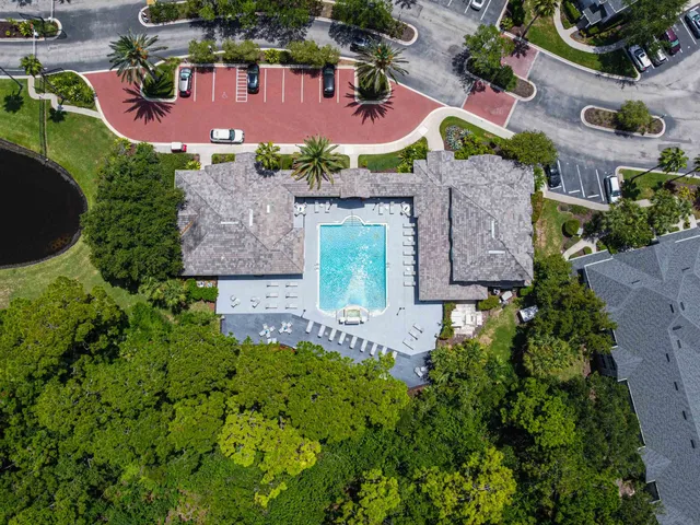 a view of a bench in the garden near a lake
