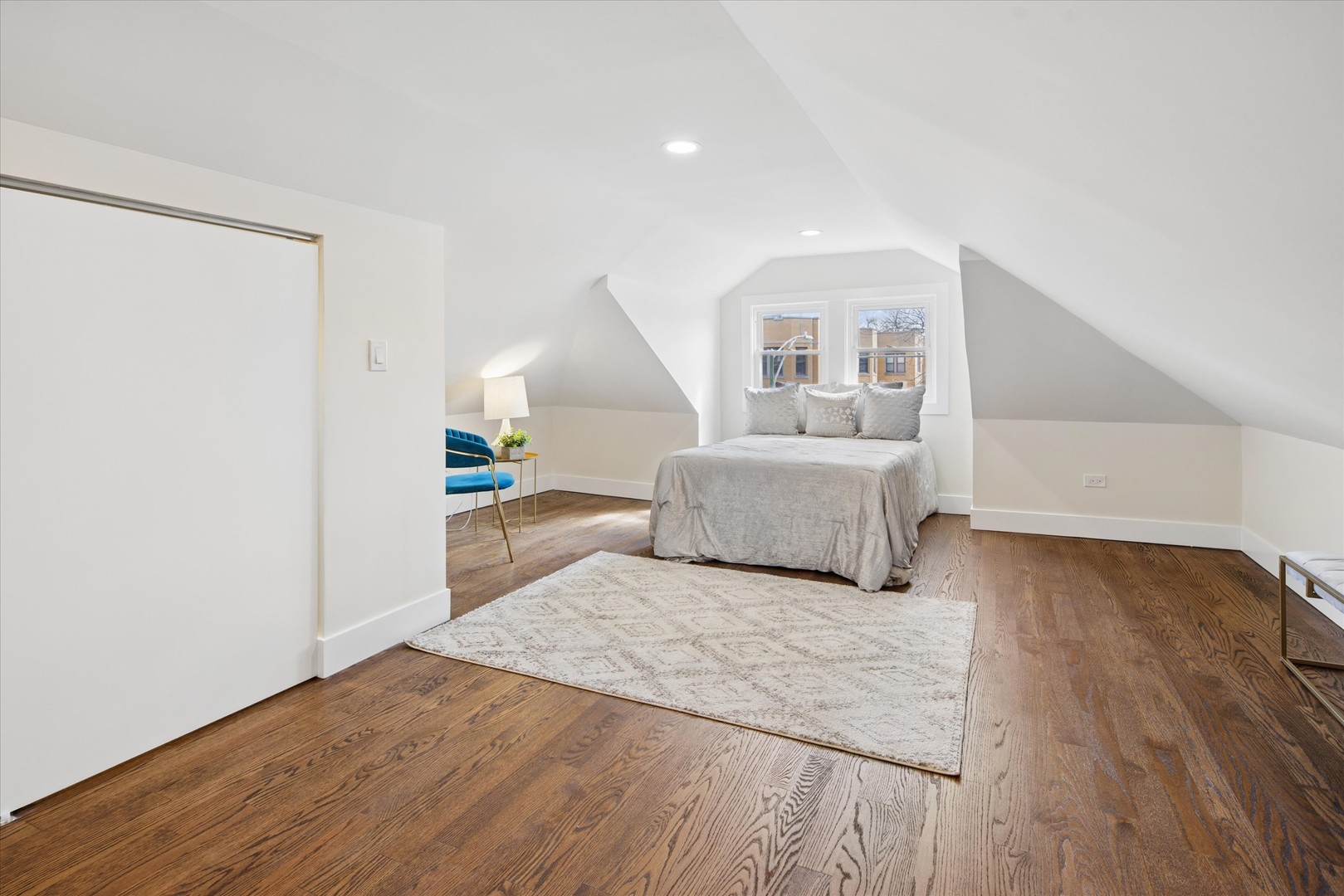 5604 North Mango Avenue Chicago, IL 60646 - Photo 12 of 20 a living room with a bed and a walk in closet
