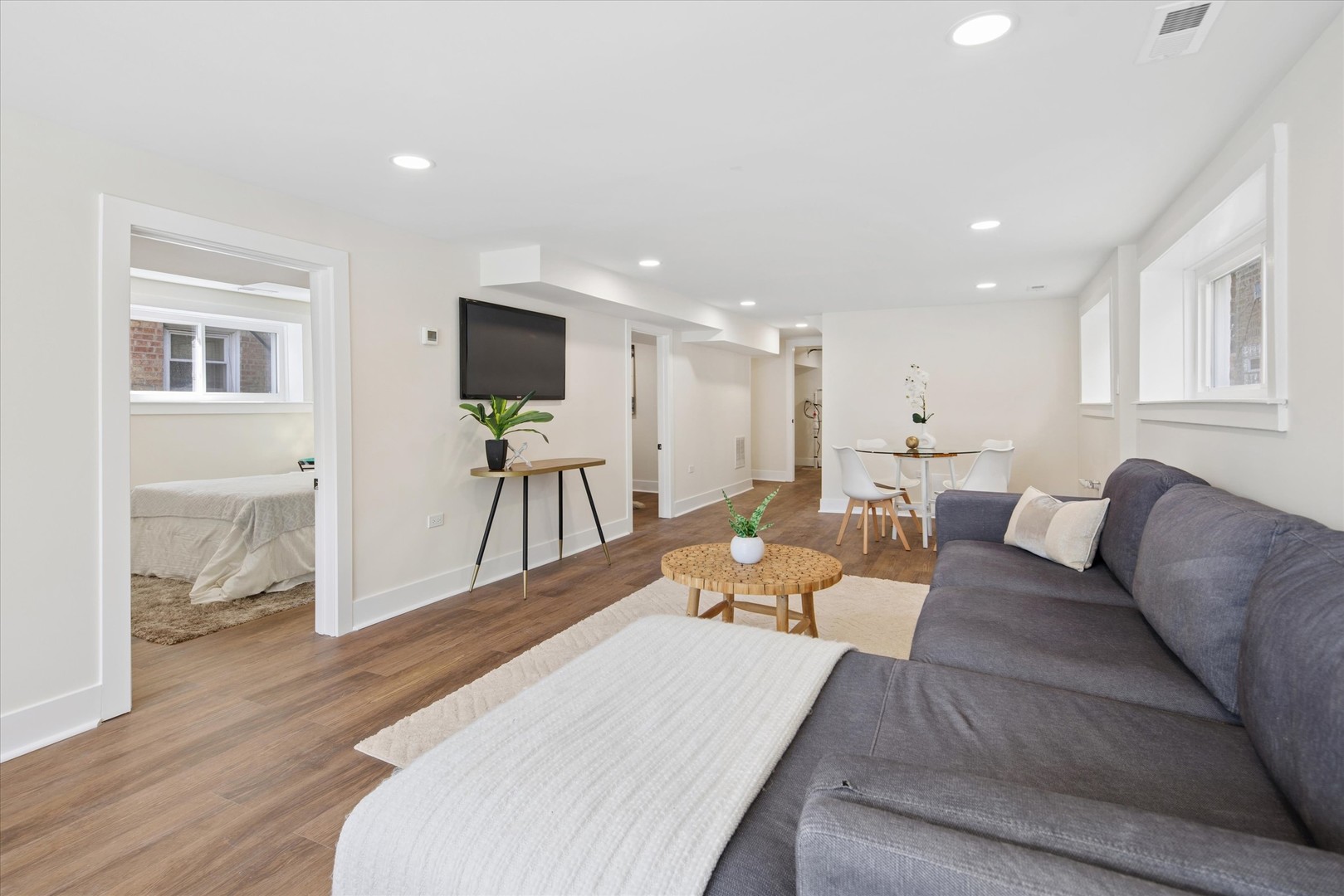 5604 North Mango Avenue Chicago, IL 60646 - Photo 15 of 20 a living room with furniture and a wooden floor
