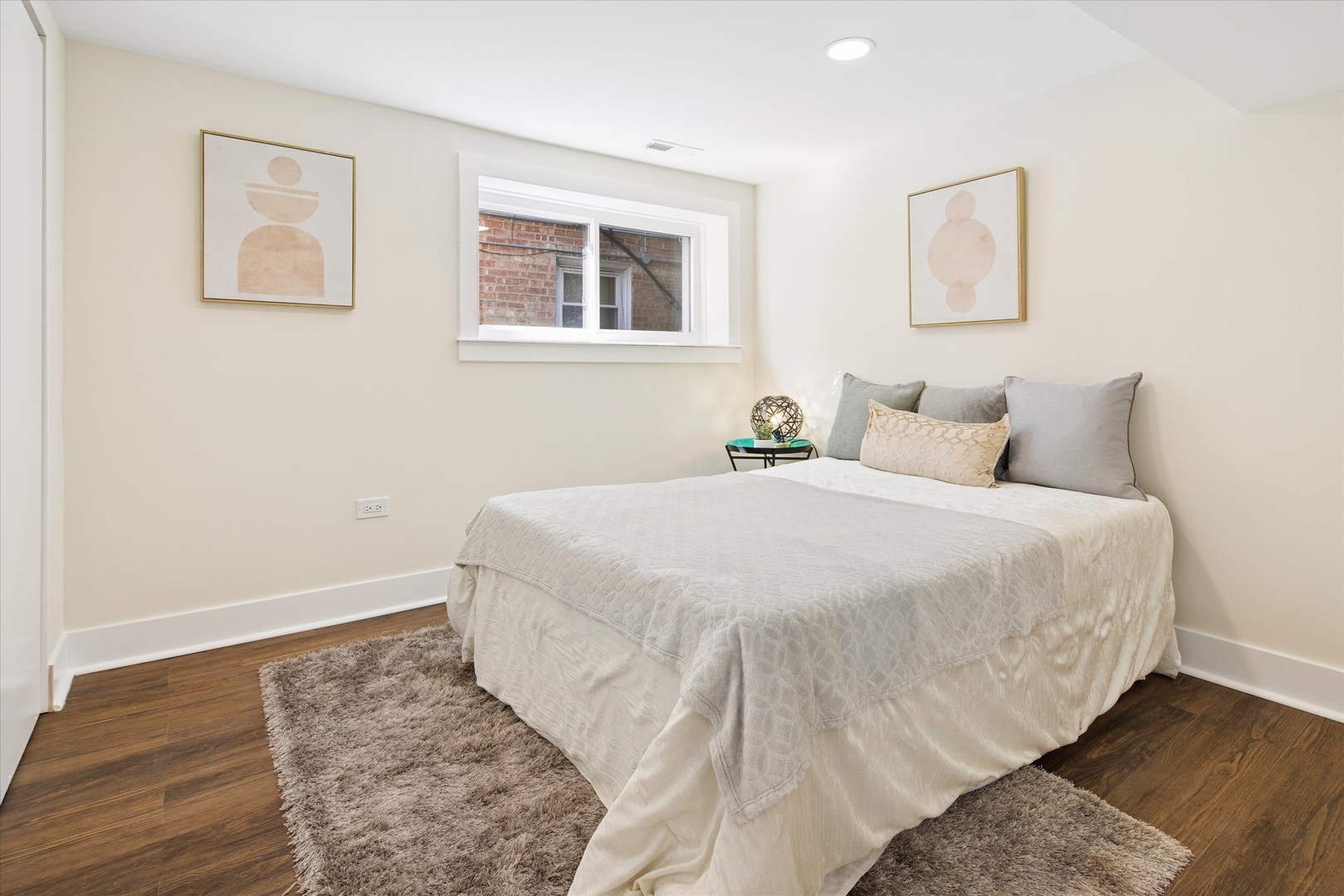 5604 North Mango Avenue Chicago, IL 60646 - Photo 17 of 20 a bedroom with a bed and wooden floor