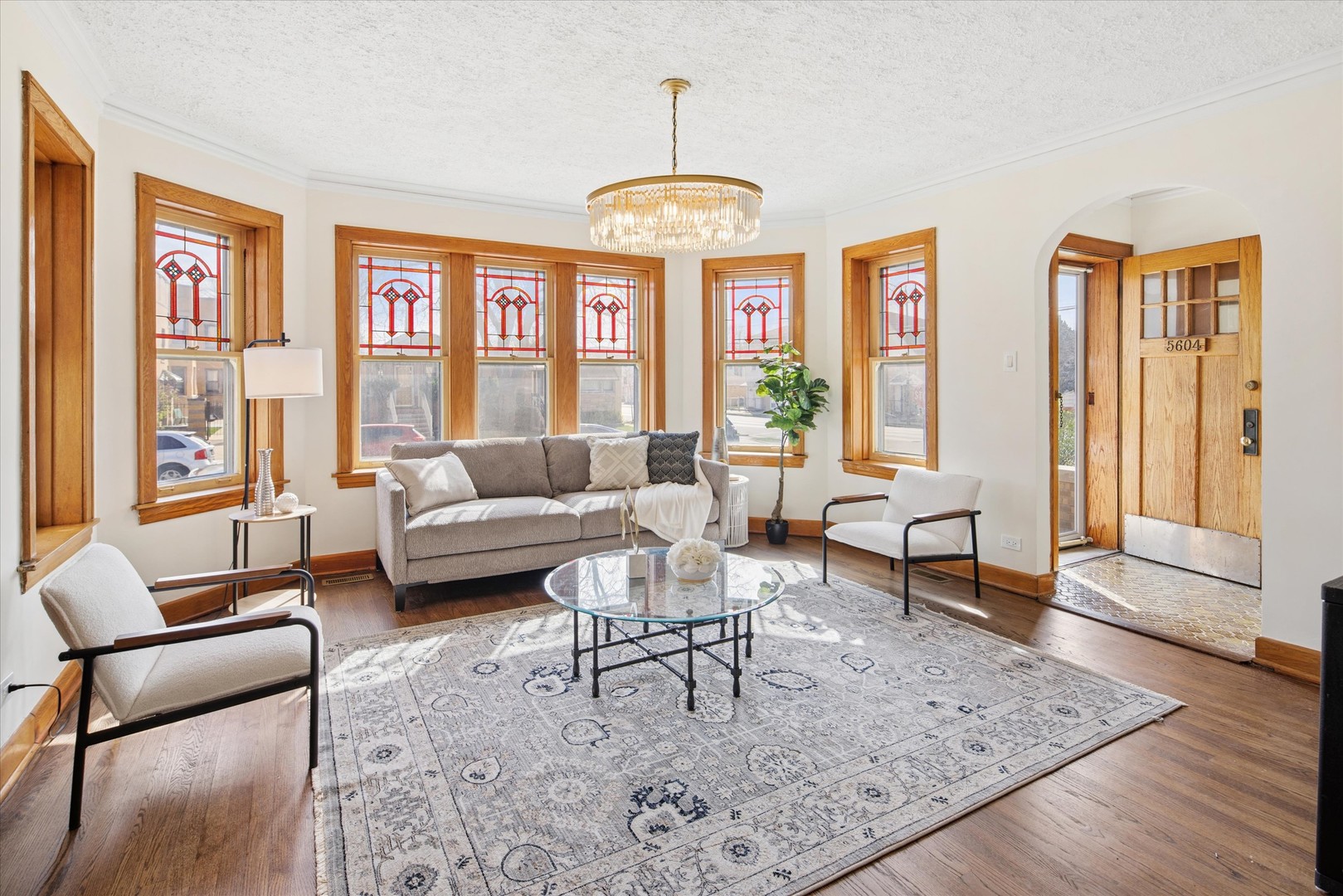 5604 North Mango Avenue Chicago, IL 60646 - Photo 2 of 20 a living room with furniture and a floor to ceiling window
