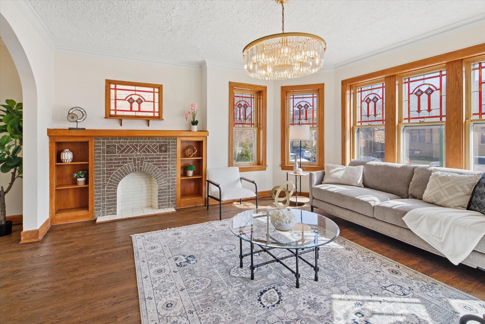 5604 North Mango Avenue Chicago, IL 60646 - Photo 4 of 20 a living room with furniture a window and a fireplace